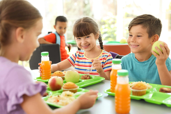 children having lunch in the school cafeteria