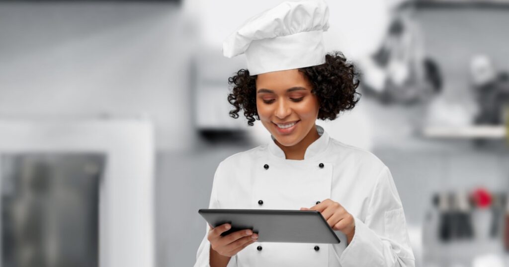 chef reviewing available menus on a tablet
