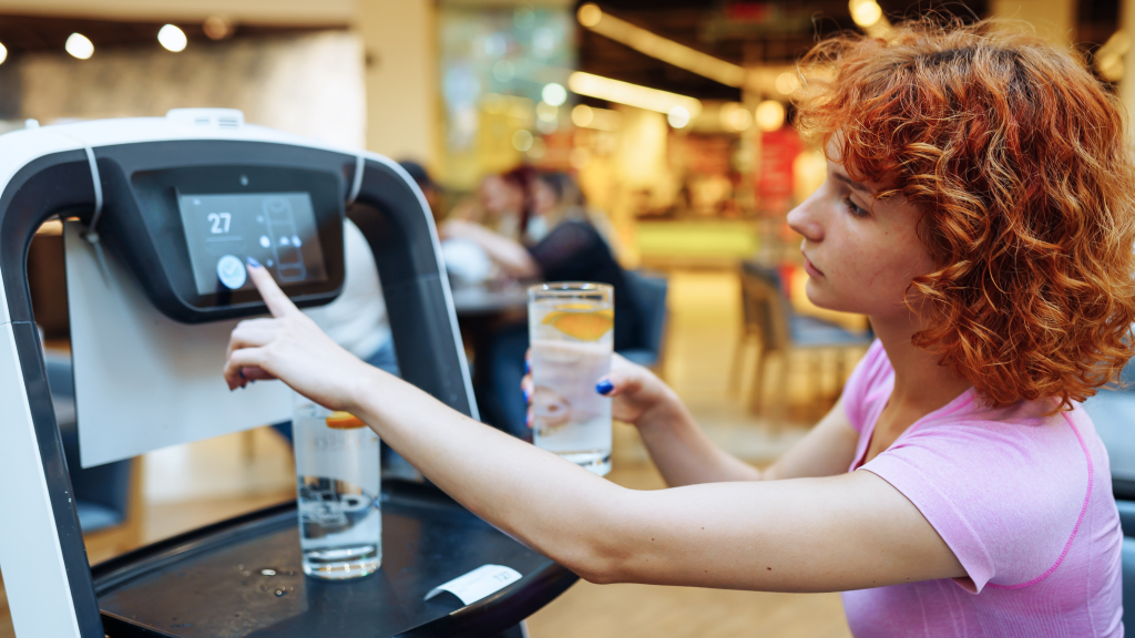 woman making a selection at a drink dispenser